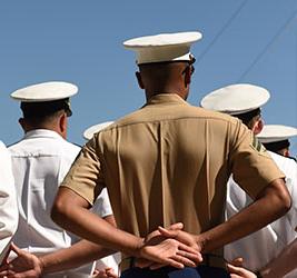 A group of Naval officers from behind